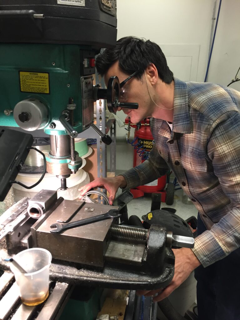 Man working on milling machine