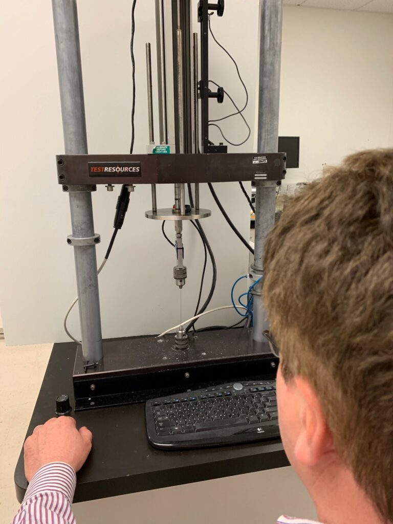 Man working with testing equipment